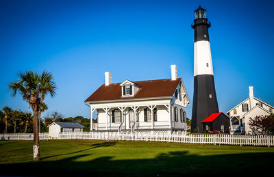 Lighthouse against clear blue sky