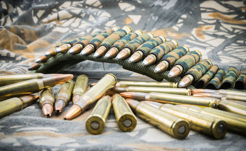 Close-up of bullets on textile