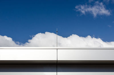 Low angle view of street and buildings against sky