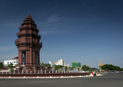 Tower of building in city against sky