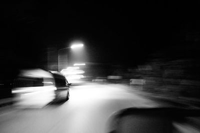 Car moving on road at night