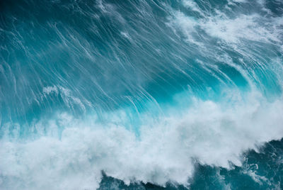 High angle view of waves splashing in sea