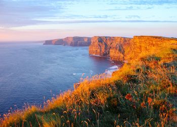 Scenic view of sea against sky during sunset