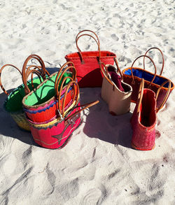 High angle view of shoes on sand at beach