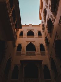 Low angle view of buildings against clear sky