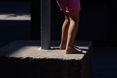 Low section of girl standing outdoors