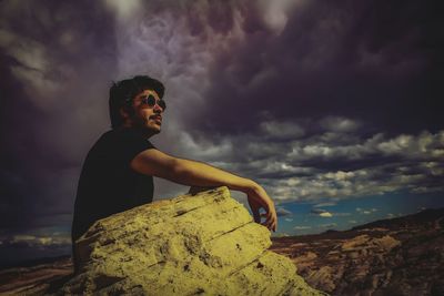 Man in sunglasses against sky