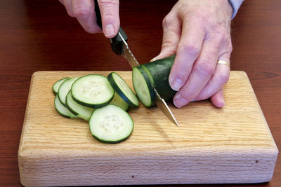 High angle view of person preparing food on cutting board