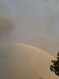 Low angle view of rainbow against sky