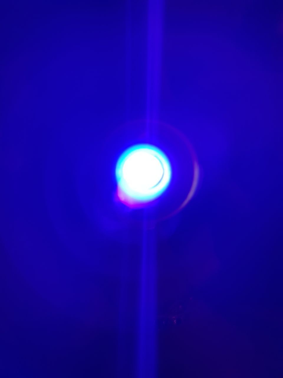 CLOSE-UP OF ILLUMINATED LAMP AGAINST BLUE SKY