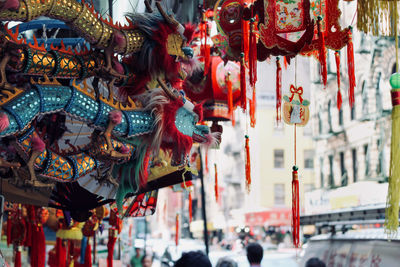 Chinese decorations hanging at market stall 