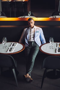 Young man sitting in restaurant