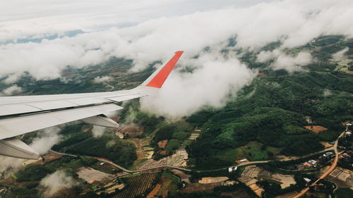 Aircraft wing over landscape