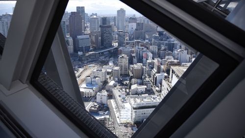 Aerial view of city seen through window