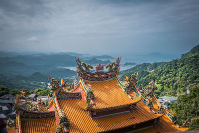 View of the roof of chinese temple at jiufen old street village on the hill in taiwan.