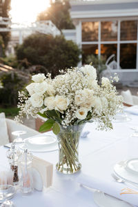 White flowers in vase on table