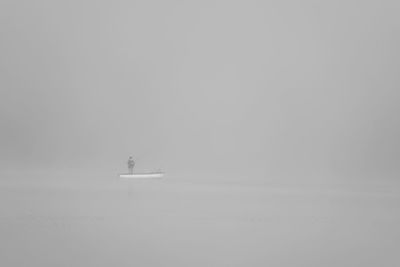 Boat sailing in sea against sky