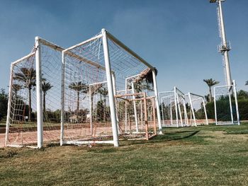 Goal post on field against sky