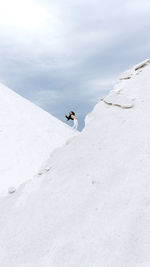Man standing on snow against sky