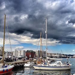 Boats moored at harbor