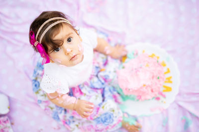 Portrait of cute girl on bed at home