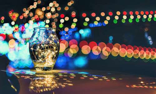 Close-up of illuminated lights on table