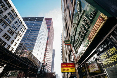 Low angle view of modern buildings against sky