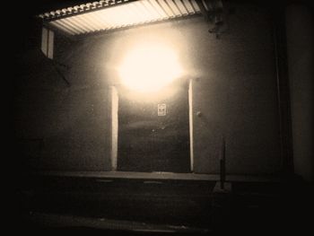 View of illuminated tunnel at night