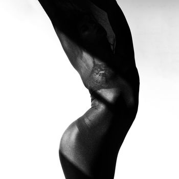 Midsection of woman standing against white background