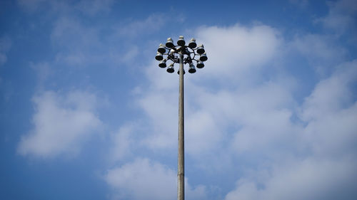 Low angle view of street light against cloudy sky