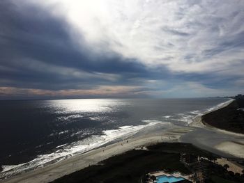 Scenic view of sea against cloudy sky