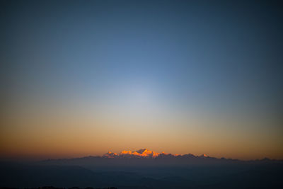 Scenic view of mountains against sky during sunset