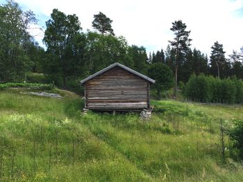 Built structure on landscape against sky