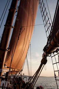 Low angle view of ship in sea against sky