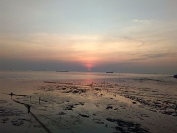 Scenic view of sea against sky at sunset