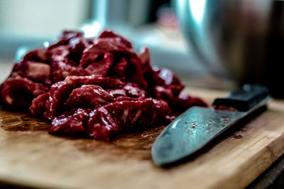 Close-up of meat on cutting board