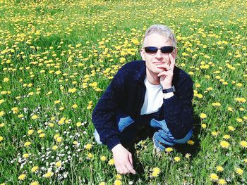 Woman standing on grassy field