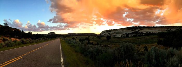 Country road passing through field