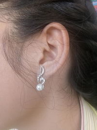 Cropped image of woman wearing earring