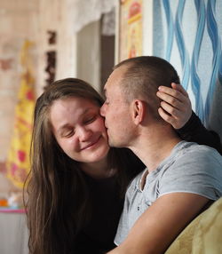 Portrait of couple kissing