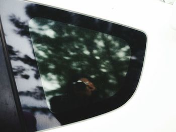 Reflection of person on glass window