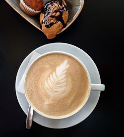 High angle view of cappuccino on table