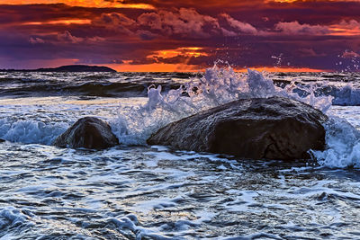 Scenic view of sea against sky during sunset