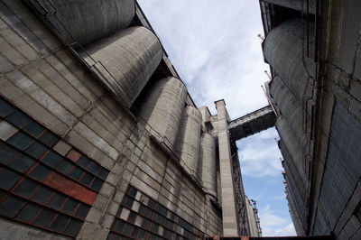 Low angle view of old industrial building against sky