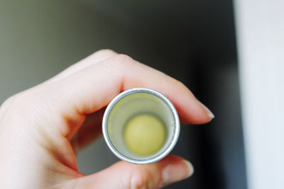 Close-up of hand holding tea cup