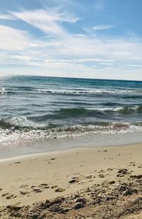 Scenic view of beach against sky
