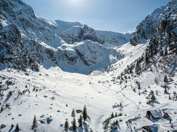 Scenic view of snowcapped mountains against sky