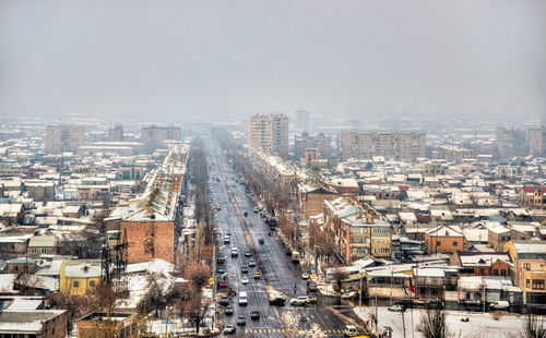 High angle view of street amidst buildings in city