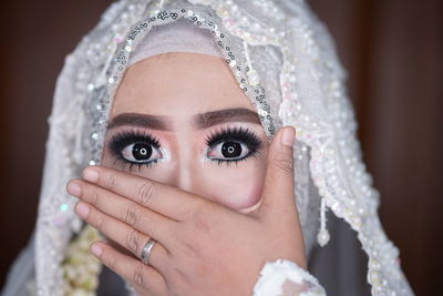 Close-up of young woman wearing wedding dress