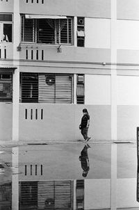 Rear view of man walking on street